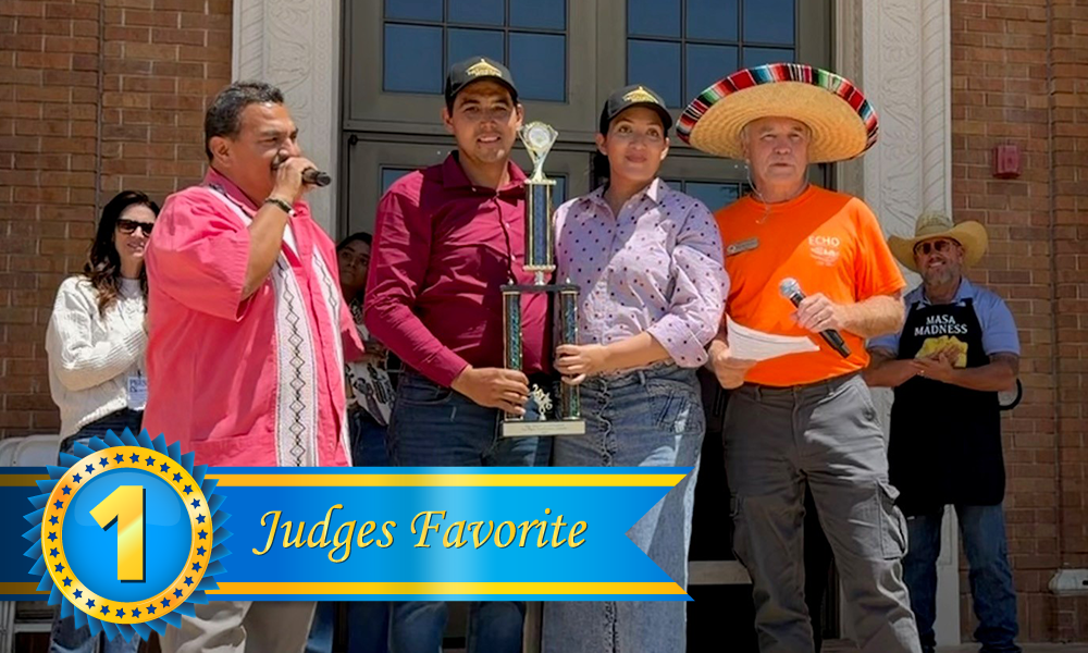 Group photo at the 2026 Tamale Festival showing the Best Traditional Tamale winner, La Luz Del Mundo from Victorville, standing on the steps of Atascadero City Hall holding their trophy, with the event MC and Mayor Charles Bourbeau,wearing a sombrero, standing on either side.